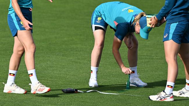 The Aboriginal flag on the socks of Australian players during their warm,-up in Hobart. (Photo by Steve Bell/Getty Images)