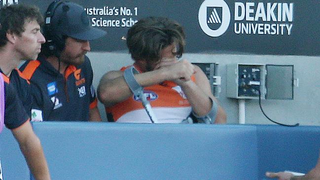 AFL Round 4. 13/04/2019. Geelong v GWS Giants at GMHBA Stadium .   Callan Ward of the Giants in tears on the bench after injuring his knee 1st quarter    . Pic: Michael Klein.