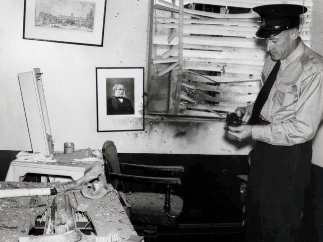 1955: A police officer checks the Wickham Terrace, Brisbane scene where a fatal shooting and bombing rampage by German immigrant Karl Kast ended with his suicide. Two doctors died in the attack and a third was shot several times. Kast was apparently angry at medical failure to support his claims of ongoing pain after a workplace accident.