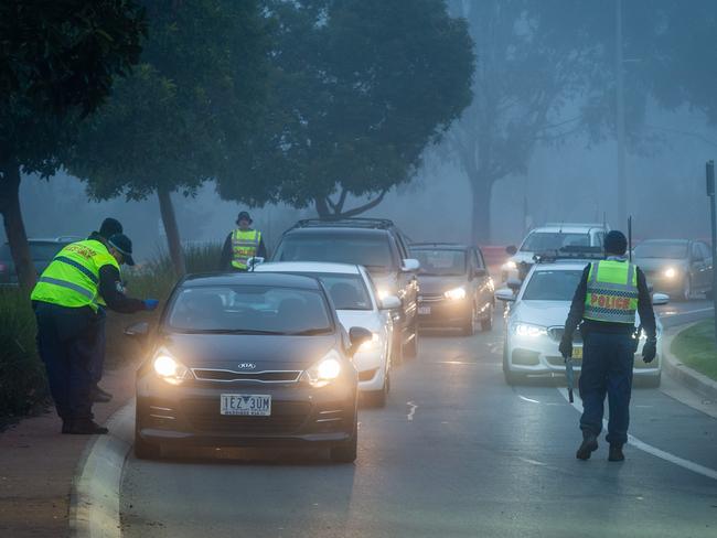 The NSW/VIC border at Echuca/Moama closes due to a second wave Covid 19 outbreak in Victoria. NSW police check drivers arriving on the NSW side of the border in Moama. Picture: Jake Nowakowski