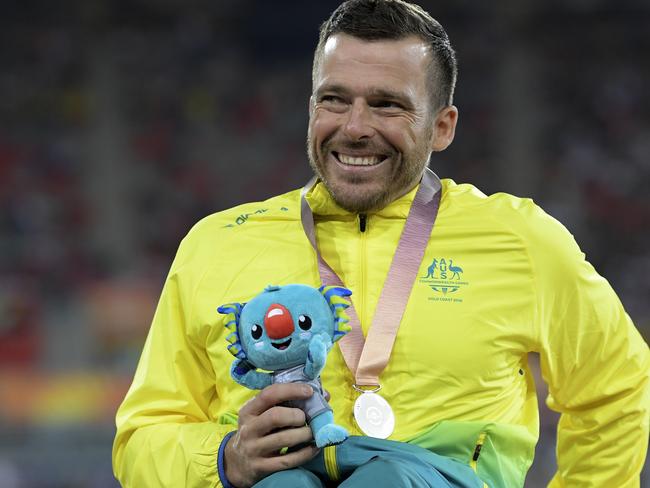 Kurt Fearnley of Australia smiles after being presented the silver medal