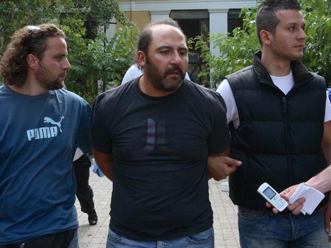 Tony Mokbel in custody in Greece.