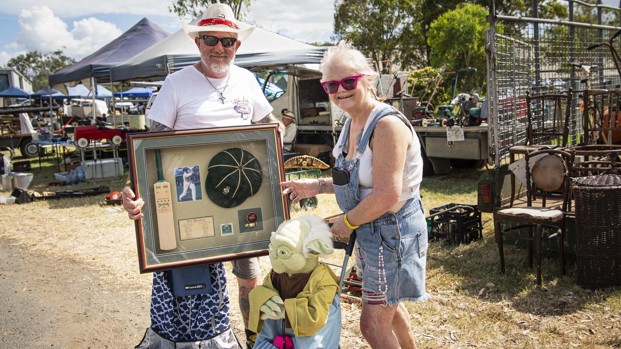 Cameron and Debbie Barnes of Hillcrest picked up framed Don Bradman memorabilia and a 1m tall Yoda at the Toowoomba Swap hosted by Darling Downs Veteran and Vintage Motor Club at Toowoomba Showgrounds, Saturday, February 1, 2025. Picture: Kevin Farmer