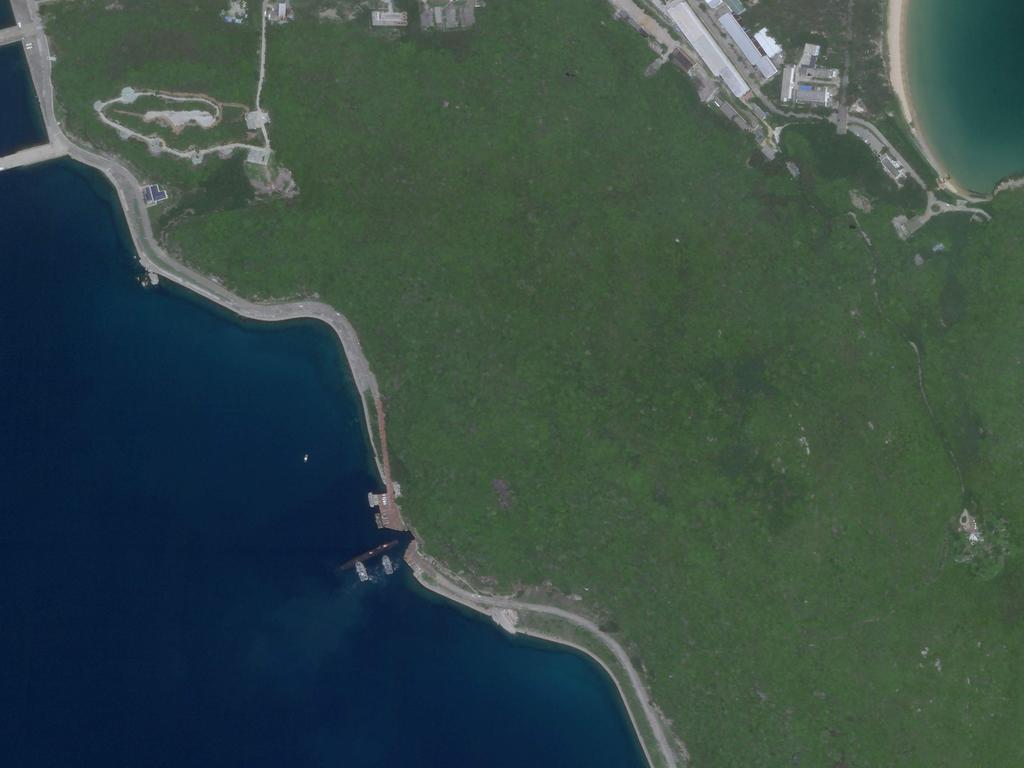 A Planet Labs image reportedly showing a Chinese submarine entering an underground base on Hainan Island on the South China Sea.