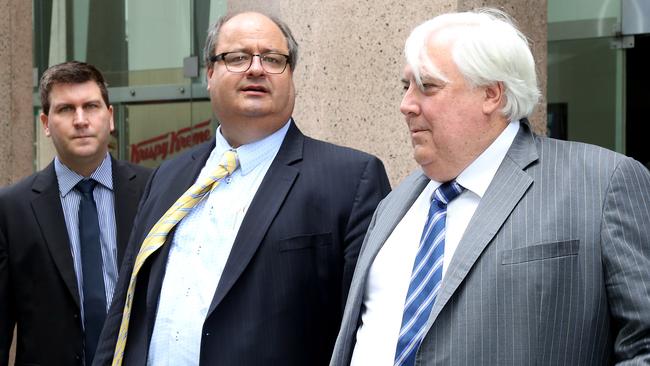 Clive Mensink and Clive Palmer leave through the back door of the Supreme Court in Perth