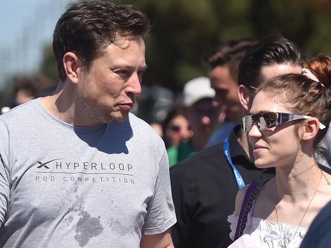 SpaxeX founder Elon Musk (L) and Canadian musician Grimes (Claire Boucher) attend the 2018 Space X Hyperloop Pod Competition, in Hawthorne, California. Picture: AFP