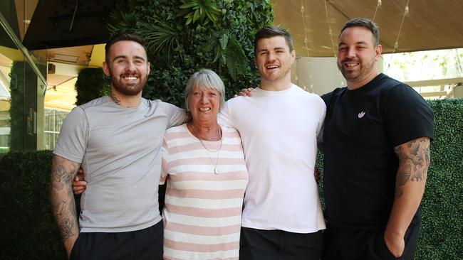 John Bateman with best friend Liam Harrison (left), grandmother Patricia Brook and brother Kyle Bateman (right). Picture: David Swift.