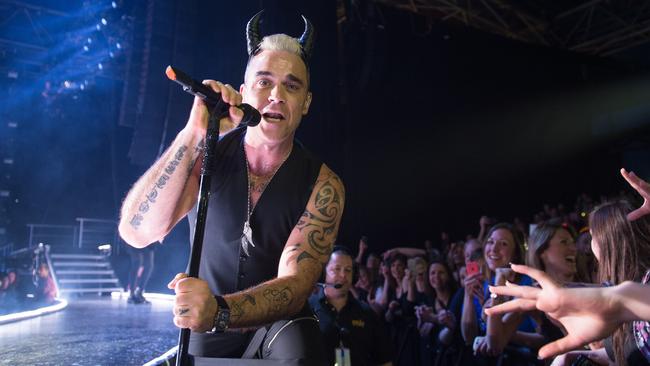 Devilishly good ... Robbie Williams performs the hits and some intriguing covers during his Let Me Entertain You show. Picture: David Wolff-Patrick