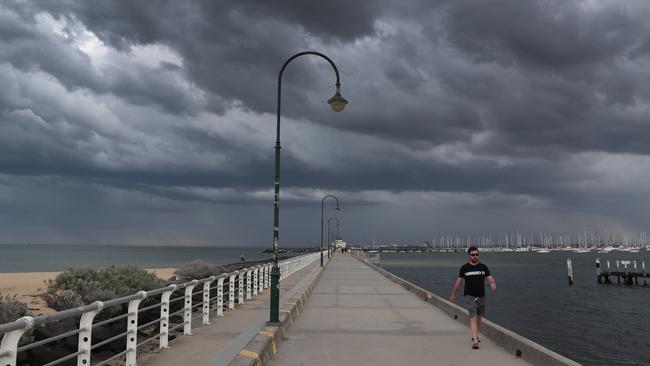 Ominous clouds over St Kilda on Friday. Picture: David Crosling