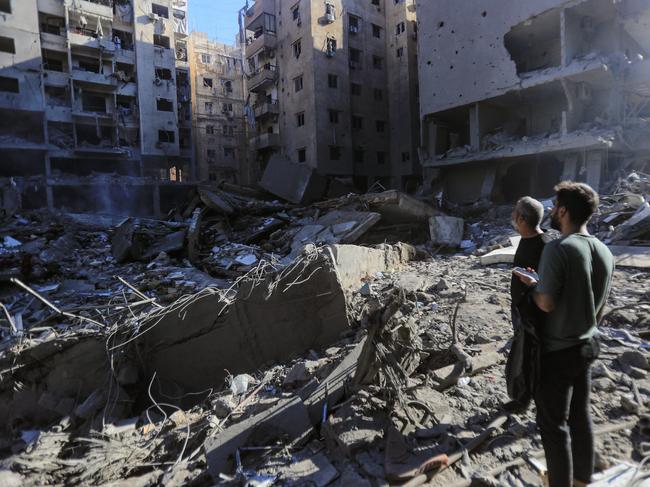 People check the rubble of buildings which were levelled on September 27 by Israeli strikes that targeted and killed Hezbollah leader Hassan Nasrallah in the Haret Hreik neighbourhood of Beirut's southern suburbs, on September 29, 2024. Israel killed Hezbollah chief Hassan Nasrallah in a huge air strike in Lebanon, dealing the movement a seismic blow that Prime Minister Benjamin Netanyahu on September 28 called a "turning point" for his country. (Photo by AFP)