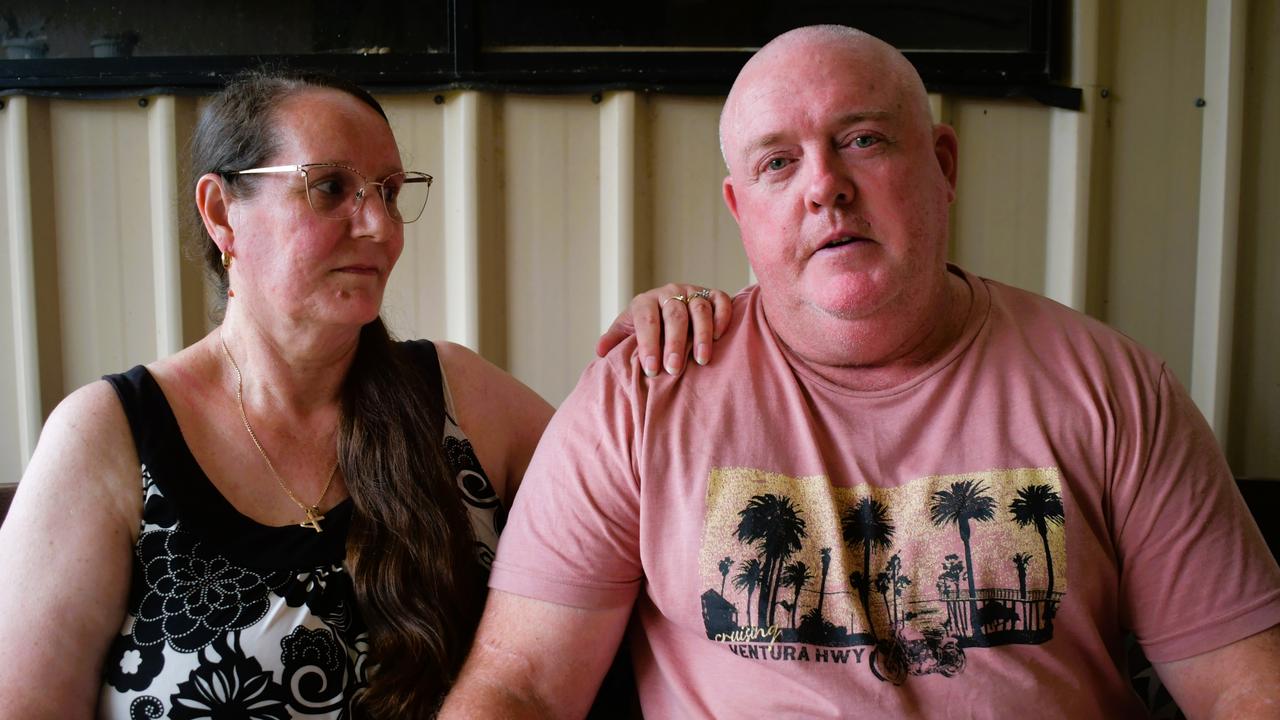 John “Benny” Benstead and wife Racheal at their home in Kirwan, Townsville. Mrs Benstead said “it kills me” to see her husband battling Reactive Airways Dysfunction Syndrome after he was allegedly covered in a load of fly ash in an alleged industrial accident driving a loader for Holcim in Bohle, Townsville in early 2023. Picture: Cameron Bates