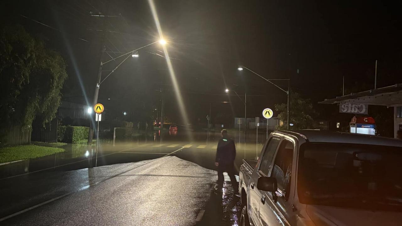 The road is flooded from The Black Bunny Cafe, PCYC, and mail centre on Perwillowen Rd Nambour. The water is not visible. A car nearly rolled when it hit the water. Photo: Jane De La Rosa