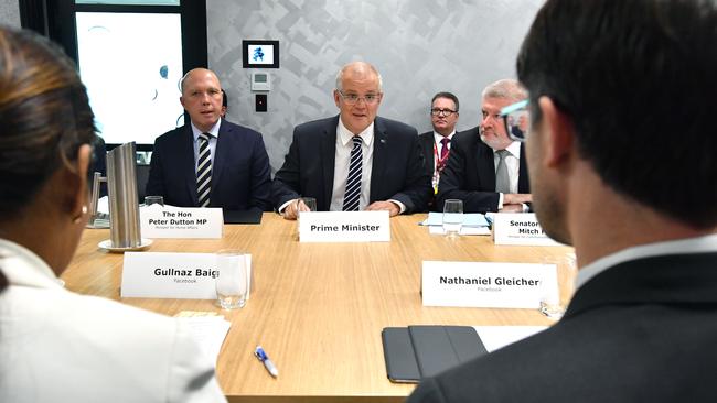 Minister for Home Affairs Peter Dutton and Prime Minister Scott Morrison face off with Facebook’s Gullnaz Baig and Nathaniel Gleicher in Brisbane. Picture: AAP Image/Darren England