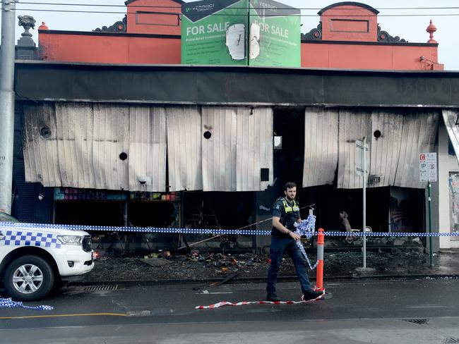 Police investigate a fire bombing of a tobacco shop on Sydney Road Coburg. Picture: Andrew Henshaw