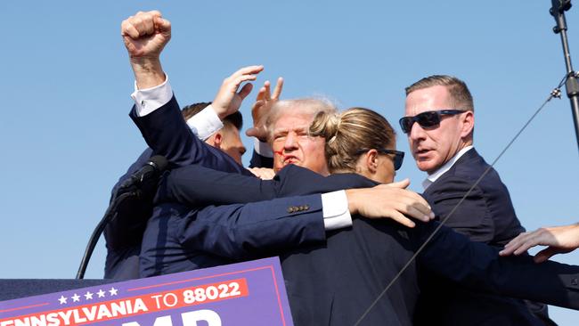 Republican presidential candidate former President Donald Trump is rushed offstage after shots were fired during a rally on July 13, 2024 in Butler, Pennsylvania. Picture: AFP