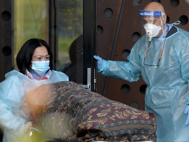 MELBOURNE, AUSTRALIA - NewsWire Photos JULY 29: A body is removed from Epping Gardens Aged Care. Picture: NCA NewsWire / Andrew Henshaw