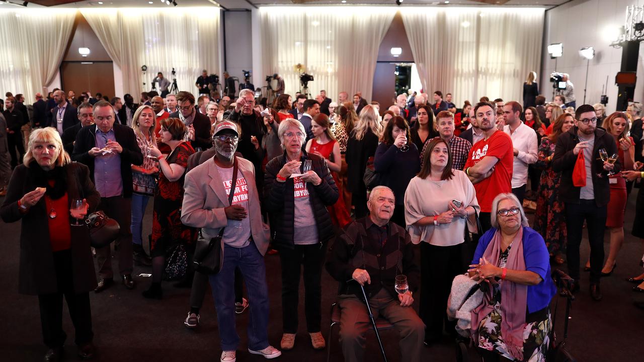 Labor supporters watch the election night coverage at Hyatt Place Melbourne on Saturday. Picture: Ryan Pierse/Getty Images