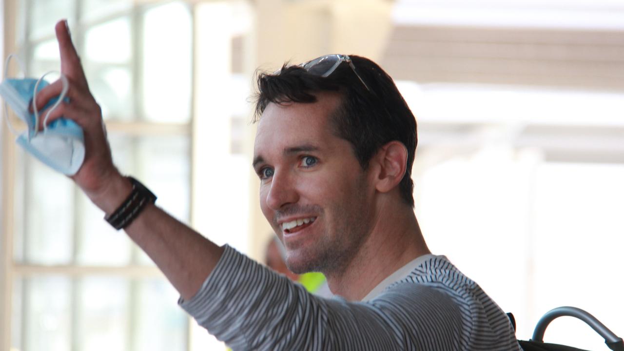 ABC journalist Bill Birtles waving as he arrived in Sydney after leaving China amid worsening diplomatic relations between the two countries. Picture: Taryn Southcombe/ABC News/AFP