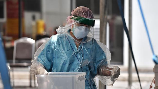 Medical workers have fought the disease at COVID-19 testing centres worldwide. Picture: Lillian Suwanrumpha /AFP