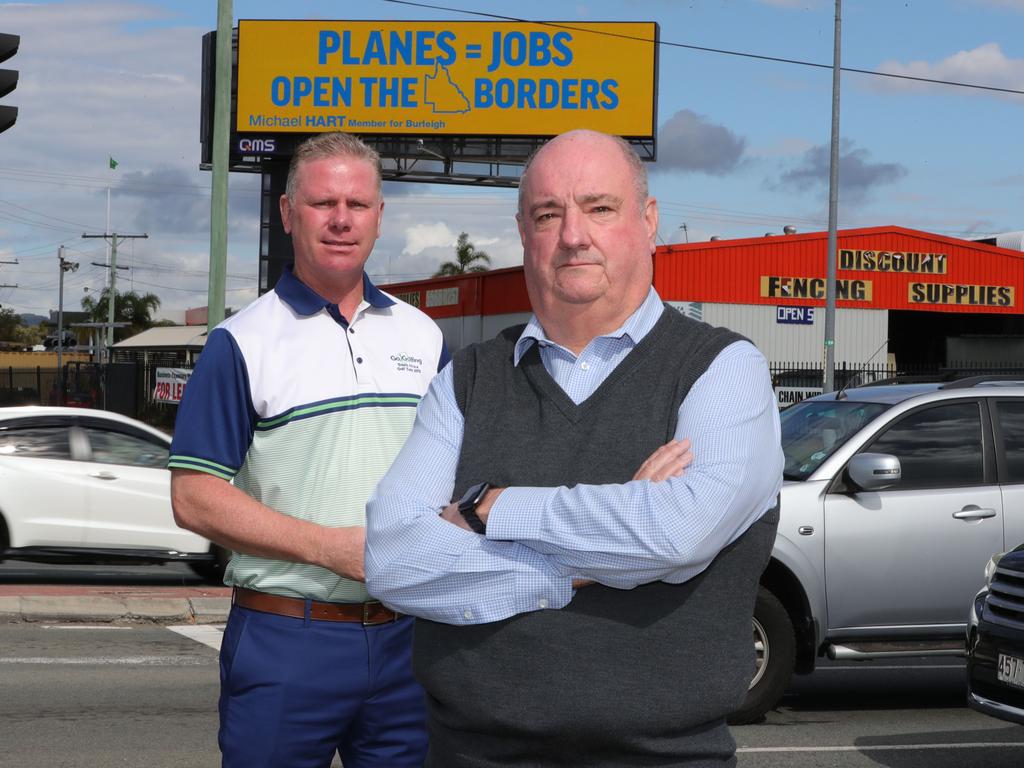 Michael Hart MP, right, has installed a giant billboard to push the state government to reopen borders. Picture Glenn Hampson