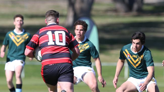 Prop Hugh Thomas charges into the Farrer defence. Picture by Peter Lorimer.