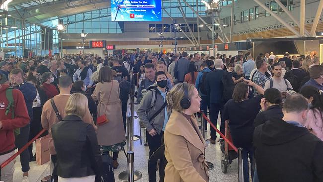 Sydney Airport has been choked with lengthy queues and irate customers at peak holiday periods.