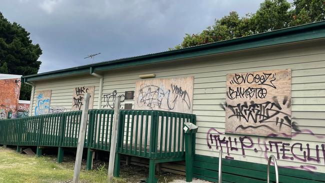 Another boarded up building in the precinct.