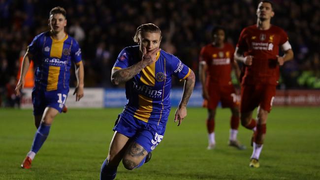 Shrewsbury’s Jason Cummings celebrates scoring his side’s first goal from the penalty spot in their fourth-round FA Cup tie against Liverpool at New Meadow. Picture: Getty Images