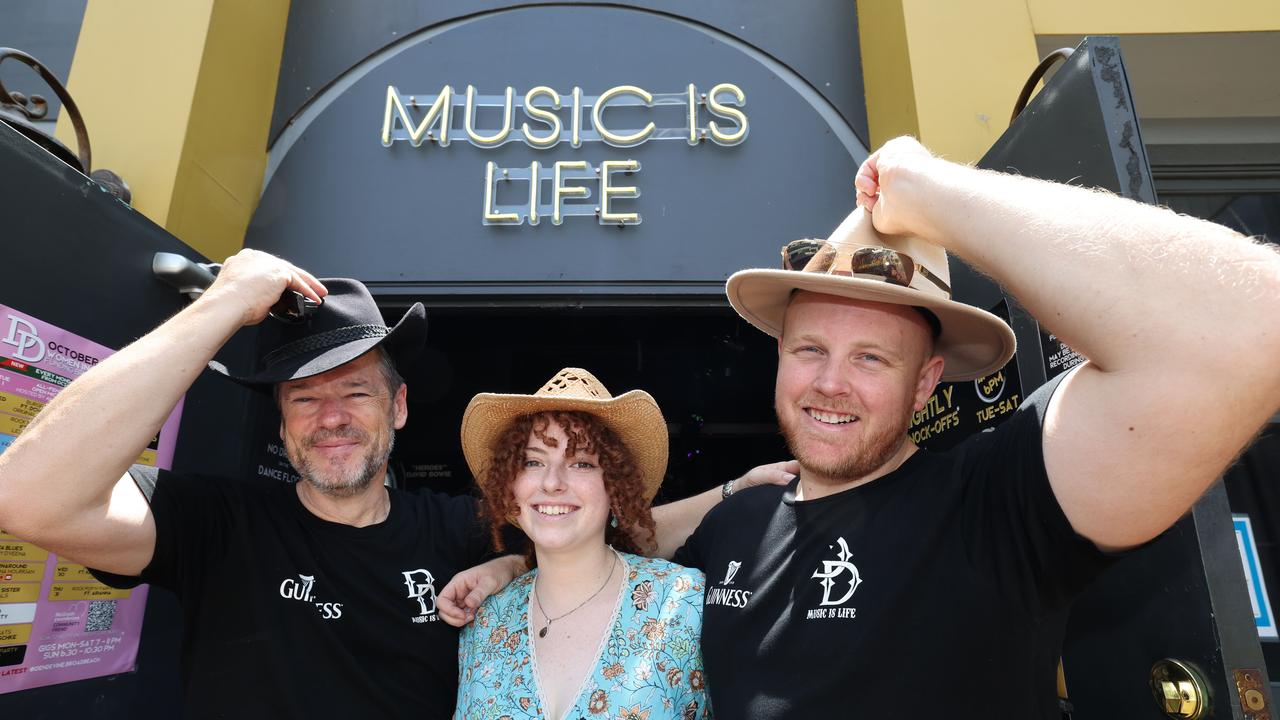 2024 Groundwater Country Music Festival has kicked off in Broadbeach. Wayne eagles, Elle Stewart and Dan Eagles outside Den Divine.. Picture Glenn Hampson