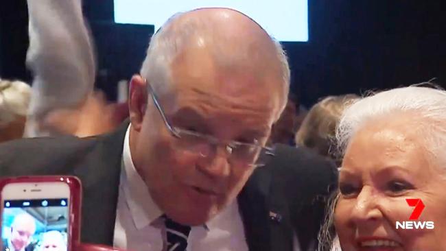 Scott Morrison moments after the egg, thrown by a protester, struck the back of his head. The egg did not break. Picture: Seven News