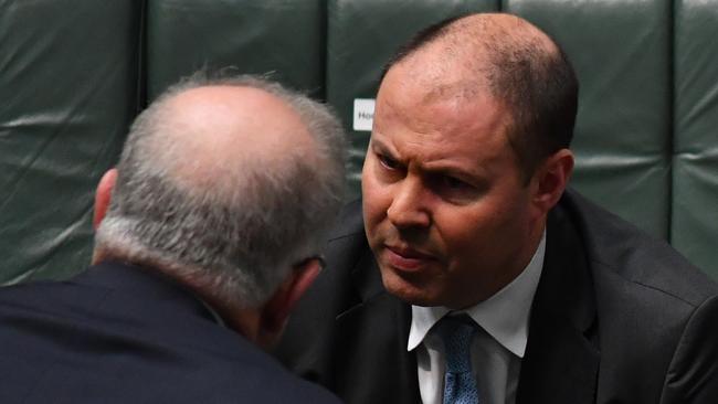 Treasurer Josh Frydenberg, seen here in conversation with Scott Morrison, recently put the total support for workers, households and businesses at $259bn. Picture: Sam Mooy