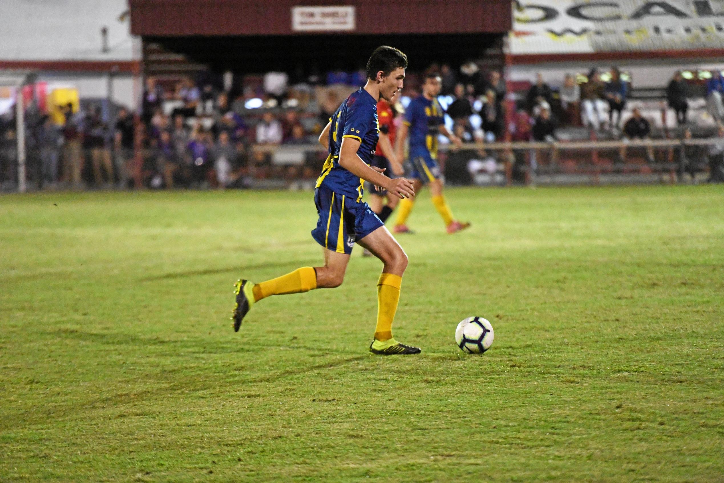 The Waves' Dylan Leggett runs with the ball during the Triple M Division 1 Cup final. Picture: Shane Jones