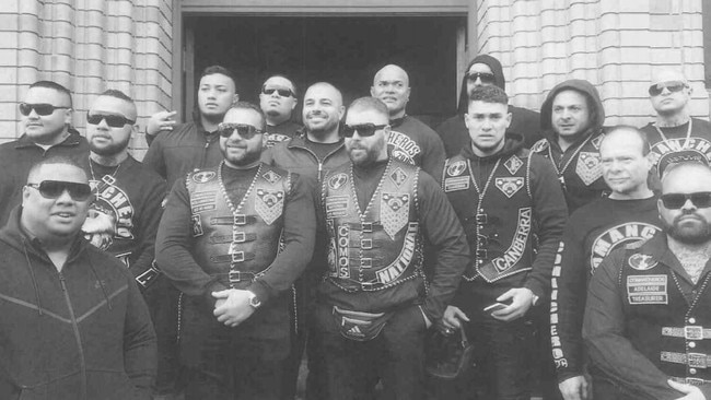 Pitasoni Ulavalu (centre rear) pictured with other senior Australian gang office holders, was stabbed and killed at Kokomo's night club in Canberra.