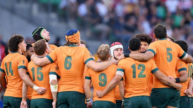 SAINT-ETIENNE, FRANCE - OCTOBER 01: The players of Australia form a huddle prior to the Rugby World Cup France 2023 match between Australia and Portugal at Stade Geoffroy-Guichard on October 01, 2023 in Saint-Etienne, France. (Photo by Laurence Griffiths/Getty Images)