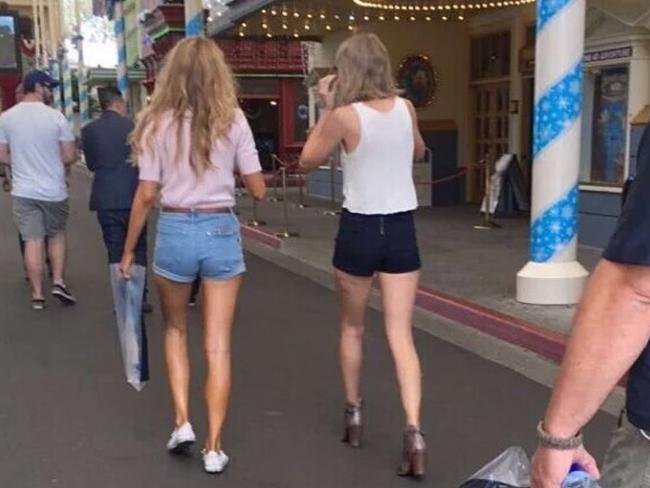 Blake Lively and Taylor Swift strolling the main street of Movie World.