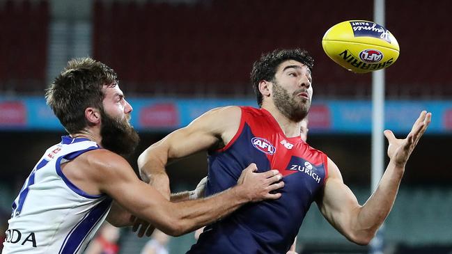 Melbourne's Christian Petracca tries to control the ball under attention from North Melbourne's Luke McDonald at Adelaide Oval. Picture: Sarah Reed