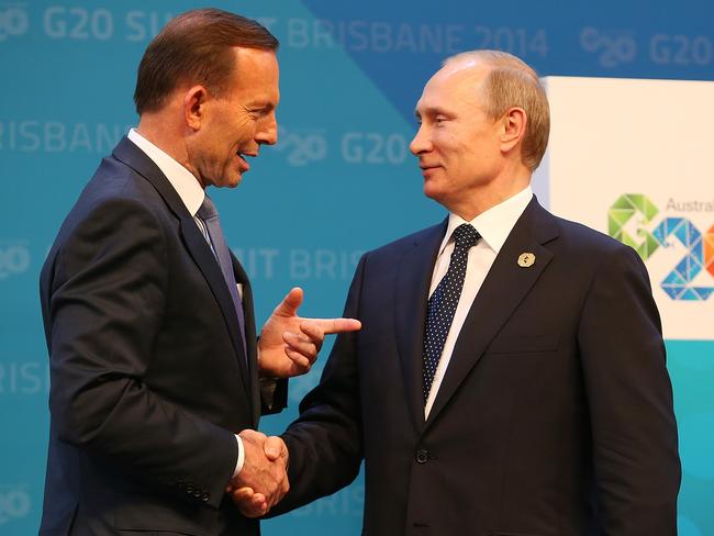Prime Minister Tony Abbott greets Russia's President Vladimir Putin during the official welcome at the Brisbane G20 summit in 2014, after he made the shirt fronting threat. Picture: Getty