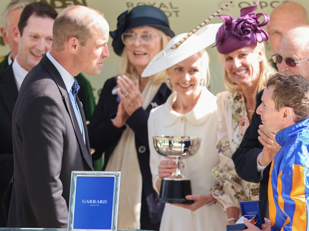 Prince William, Prince of Wales (L) speaks to a winning team during a presentation as he attends day two of Royal Ascot 2024. Picture: Getty Images