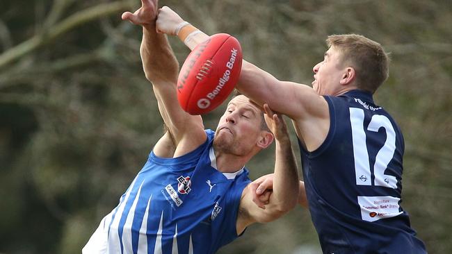 Trent Farmer (left, in action against Croydon) led the ‘Roos attack with four goals, including three in the third term. Picture: Hamish Blair