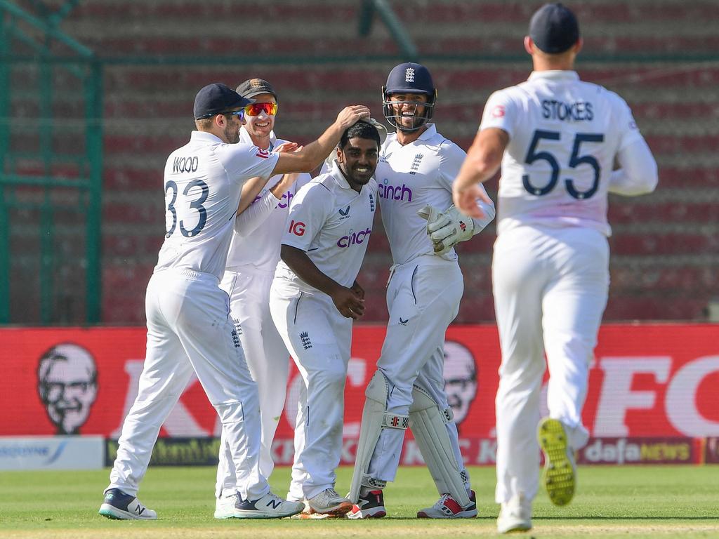 England's Rehan Ahmed celebrates with teammates after taking the wicket of Pakistan's Saud Shakeel. Picture: Asif Hassan
