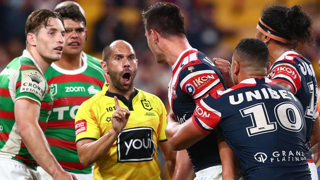 Referee Ashley Klein speaks with Joseph Manu of the Roosters after a high tackle from Latrell Mitchell (Photo by Chris Hyde/Getty Images)