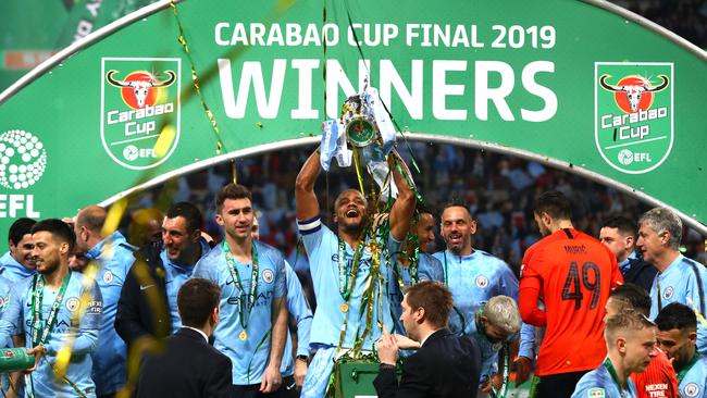 Vincent Kompany of Manchester City lifts the trophy after winning the Carabao Cup Final. Picture: Getty Images
