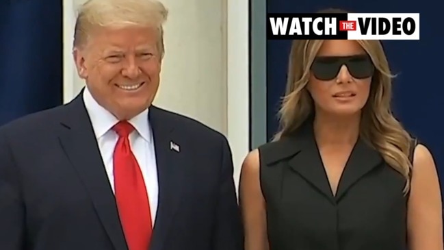 Melania grimaces at Trump's 'smile' order