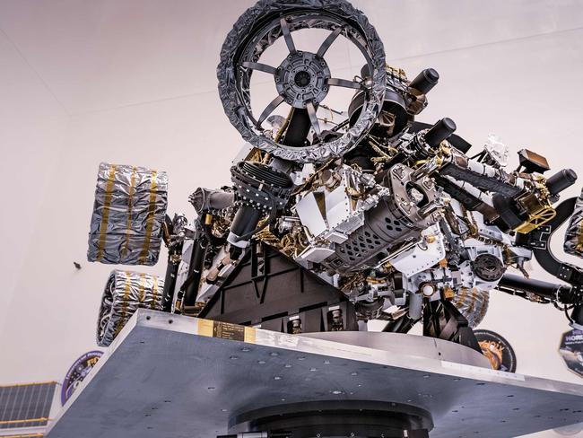 In this undated image obtained from NASA, NASA's Perseverance rover is attached to a spin table during a test of its mass properties at the Kennedy Space Center in Florida. - NASA's most advanced Mars rover, Perseverance, launches from Earth on July 30, on a mission to seek out signs of ancient microbial life on what was once a river delta three-and-a-half billion years ago. The interplanetary voyage will last six months. (Photo by - / NASA / AFP) / RESTRICTED TO EDITORIAL USE - MANDATORY CREDIT "AFP PHOTO / NASA " - NO MARKETING - NO ADVERTISING CAMPAIGNS - DISTRIBUTED AS A SERVICE TO CLIENTS