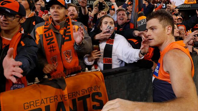 Heath Shaw of the Giants celebrates with fans