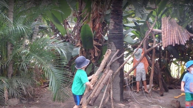 Children get busy building a hut at Everton Park childcare centre.