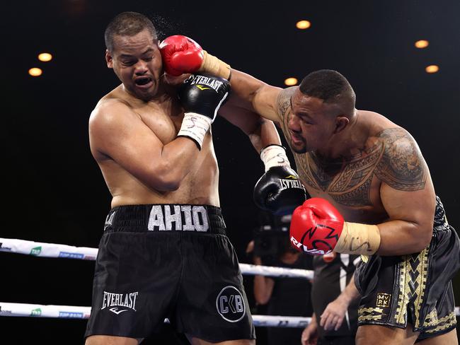 Django Opelu lands a big right hand on Hemi Ahio. Picture: Kelly Defina/Getty Images