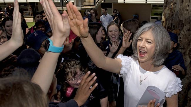 SA’s chief public health officer Nicola Spurrier high-fives school students at The Heights School. Picture: NCA NewsWire / Naomi Jellicoe