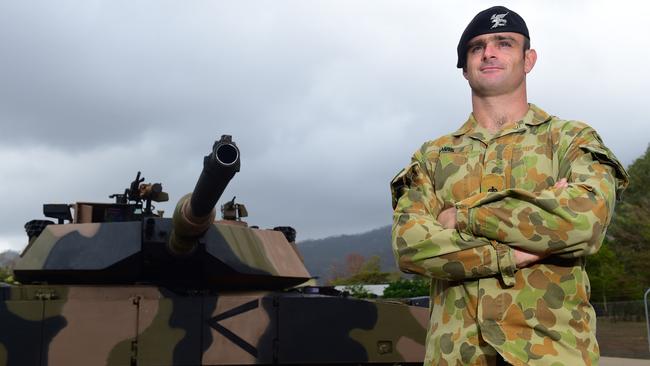 Commanding Officer 2nd Cavalry Regiment Lieutenant Colonel James Davis with an Abrams tank at Lavarack Barracks. Picture: Evan Morgan