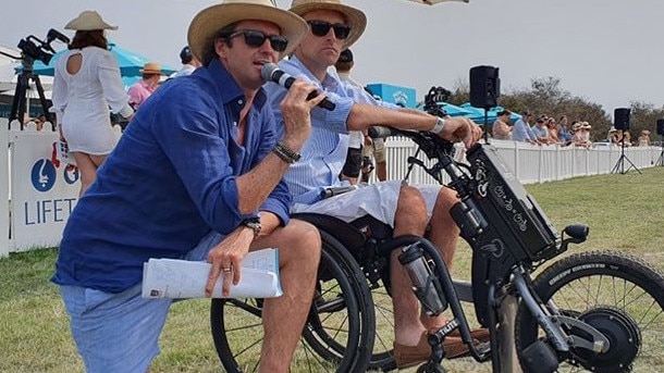 Angland on his scooter with Hamish McLachlan. Picture: Supplied